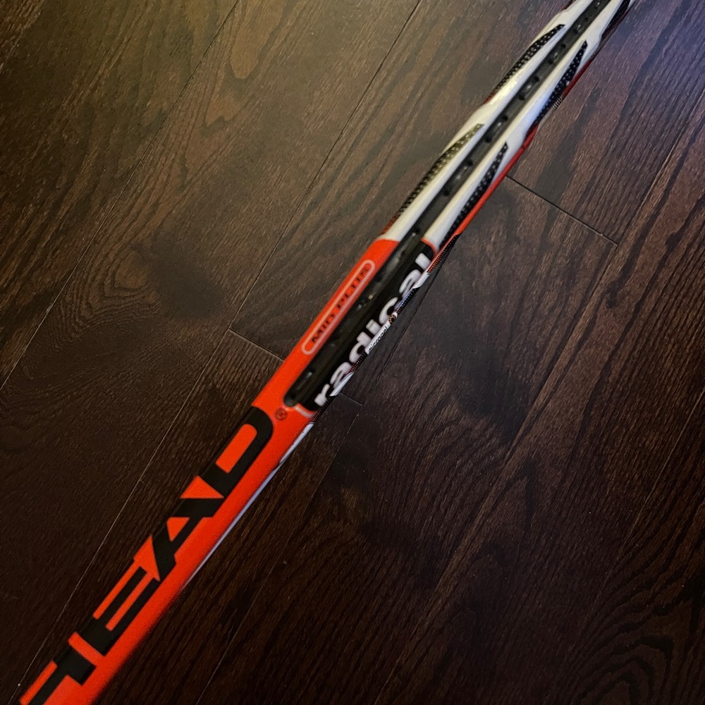 HEAD Tennis Racket with Red and White Accents